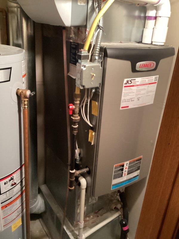 Performed annual tune-up on Lennox air handler system. Inspected condensate drainage configuration including PVC pipes and connections. Checked thermostat functionality and system controls. Examined furnace/air handler components and connections, including gas line and electrical conduits. All systems operating normally after service with no issues identified.