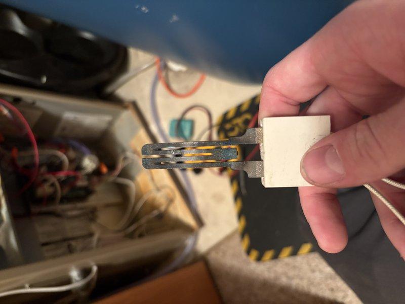 Diagnosed furnace with no heat condition due to faulty ignitor. Removed failed component and installed new replacement ignitor. System successfully tested with proper ignition and flame establishment, restoring normal heating operation.