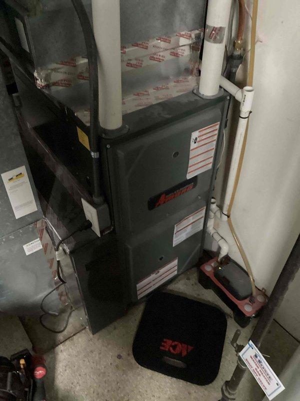 Performed scheduled tune-up service on an Amana furnace system located in utility area. Conducted comprehensive inspection and maintenance including system function checks, component cleaning, and verification of proper operation. Unit is now operating within normal parameters with no issues identified.