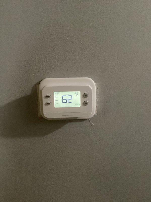 Responded to an emergency no-heat call where the furnace was blowing cold air. Diagnosed a failed thermostat and replaced it with a new Honeywell digital unit. System restored to proper operation with client's on-site approval.