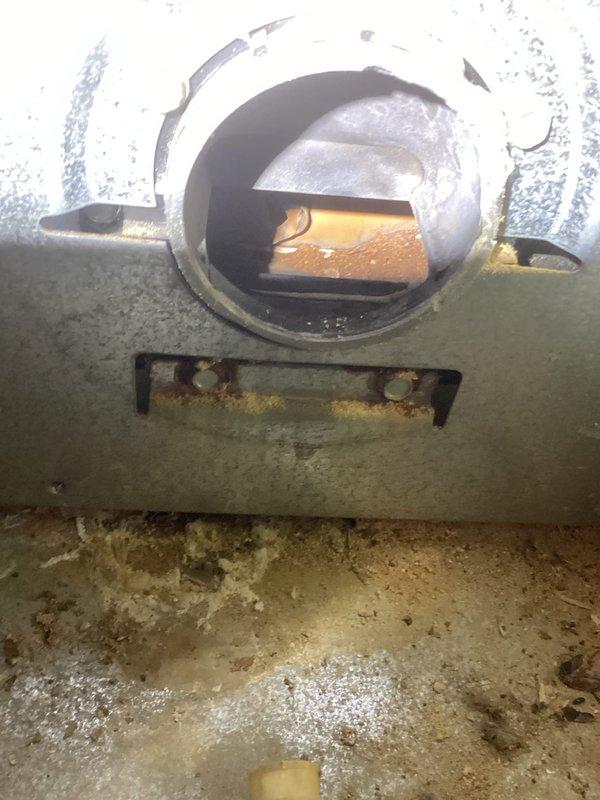 Responded to no heat complaint and found severely clogged heat exchanger with significant corrosion and deterioration. Inspection revealed extensive rust on multiple components including metal brackets and internal connections. Replacement of unit recommended due to safety concerns and irreparable damage.