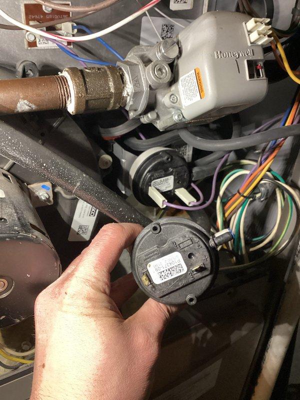 Responded to no heat complaint in commercial unit. Diagnostic testing revealed failed pressure switch. Removed defective component and installed new OEM pressure switch, restoring proper system operation and heat function.