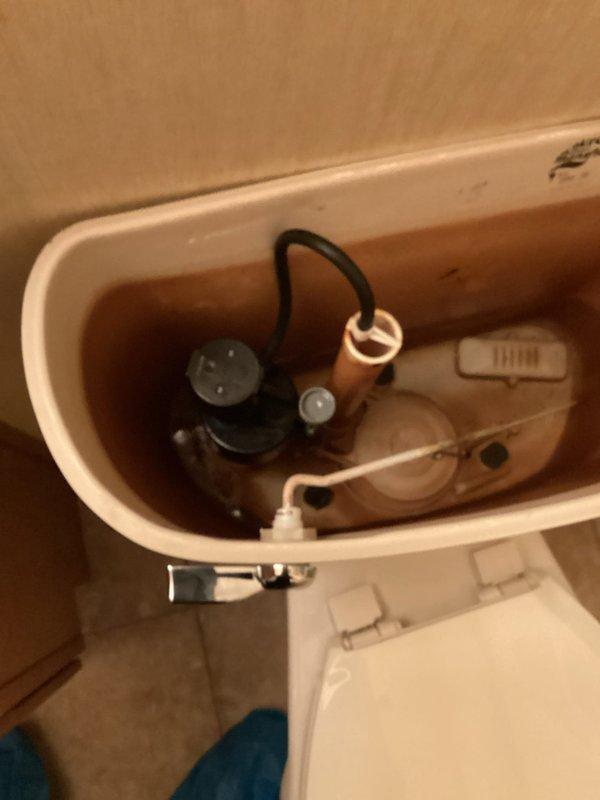 Responded to service call regarding malfunctioning toilet with fill valve issue. Upon inspection of Mansfield toilet, determined the mechanical flow control component had failed. Removed the defective fill valve and installed a new replacement unit. After restoration of water supply, verified proper filling function and successful toilet operation.