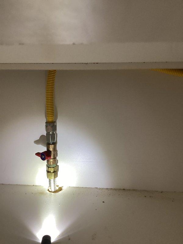 Responded to service call to cap gas line for kitchen stove conversion to electric appliance. Successfully disconnected and safely capped the existing gas supply line to stove using appropriate brass fittings. Verified installation with pressure test to ensure proper seal and no gas leaks at the connection point.