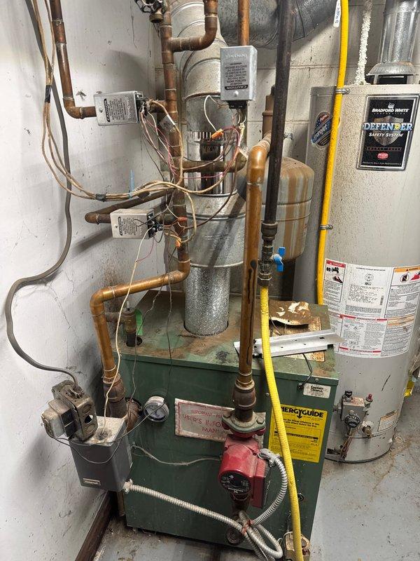 Responded to no-heat call for a 25-year-old New Yorker boiler. Diagnosed tripped high limit due to clogged heat exchanger. Reset limit to restore temporary operation. Recommended full replacement of aging unit as heat exchanger is significantly obstructed. Project manager scheduled to provide replacement estimate.