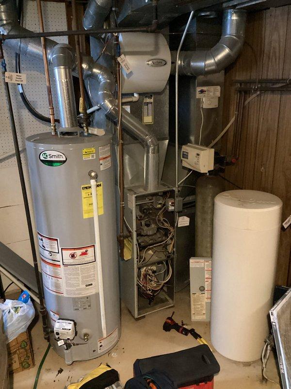 Responded to no heat call for a 10+ year old Carrier furnace. Upon inspection, found the inducer motor was seized, preventing furnace ignition. Due to the unit's advanced age and overall deteriorated condition, replacement of the entire furnace system was recommended to the customer.
