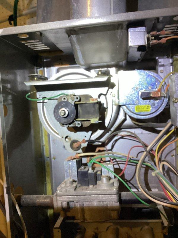Responded to no heat call for a 10+ year old Carrier furnace. Upon inspection, found the inducer motor was seized, preventing furnace ignition. Due to the unit's advanced age and overall deteriorated condition, replacement of the entire furnace system was recommended to the customer.