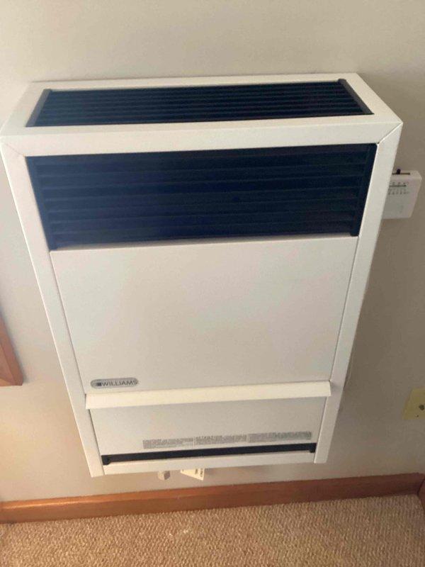 Arrived at 12-4 and installed a thermocouple for a Williams wall-mounted heating unit. Unit was properly mounted and appears in good working condition with all components functioning as intended after service completion.