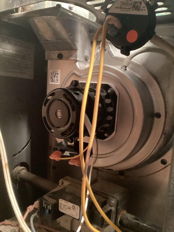 Responded to no-heat call for aging system (10+ years). Diagnosed failing draft inducer motor as evidenced by inspection of blower assembly. Installed new draft inducer per approved bid, verified proper operation of the system, and restored heating functionality.