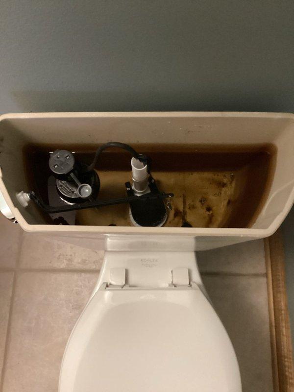 Responded to service call for toilet experiencing phantom flushing. Diagnosed issue as a flapper that wasn't sealing properly, causing slow water leakage into the toilet bowl. Installed new flapper which resolved the intermittent flushing problem.