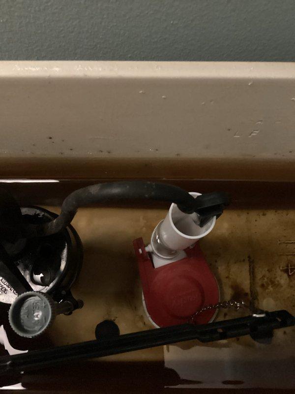 Responded to service call for toilet experiencing phantom flushing. Diagnosed issue as a flapper that wasn't sealing properly, causing slow water leakage into the toilet bowl. Installed new flapper which resolved the intermittent flushing problem.