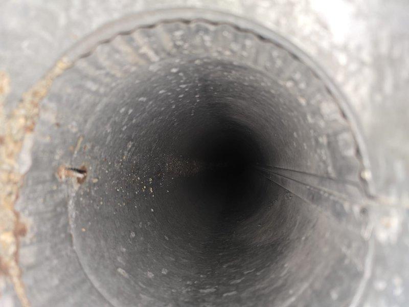 Performed comprehensive duct cleaning service on HVAC system and dryer vent to remove accumulated dust and debris. Utilized digital anemometer (HAEOTSET HT605) to verify proper airflow measurements before and after cleaning. Interior inspection revealed significant buildup that was successfully removed, restoring optimal system performance and improving indoor air quality.