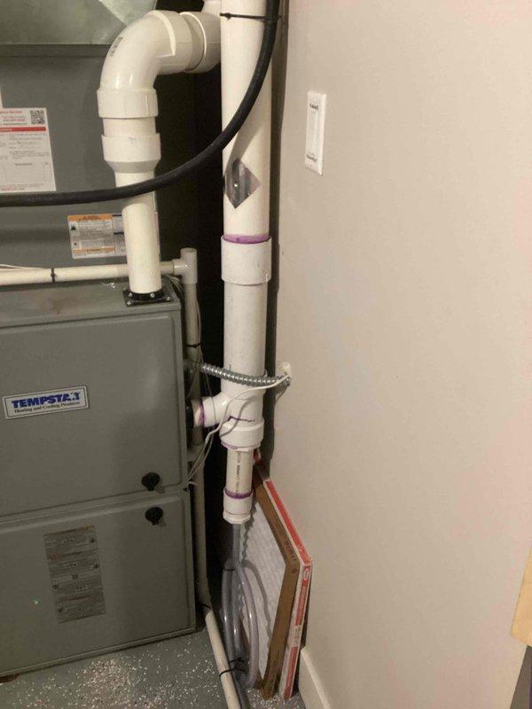 Responded to call back for furnace repeatedly shutting down due to condensation issues. Upon inspection, determined condensate was flooding system and causing operational failure. Installed T-fitting in the condensate drain line to improve drainage and prevent further condensation buildup.