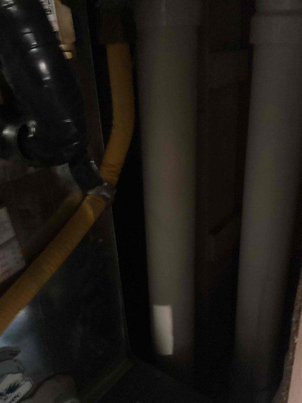 Performed scheduled furnace tune-up service with focus on system inspection and operational verification. Examined ventilation components including black exhaust pipe and flexible connector, as well as inspected adjacent white PVC intake pipes. Complete tune-up completed with all systems functioning properly.