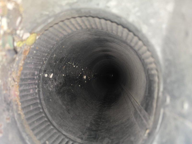 Performed comprehensive duct cleaning service on HVAC system, arriving between 7:30-8:00am as scheduled. Removed significant dust and debris accumulation from ductwork as evidenced by inspection photos showing particulate buildup on interior surfaces of cylindrical ducts. Thoroughly cleaned all supply and return vents to improve system airflow and indoor air quality.