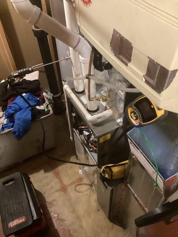 Performed scheduled preventative maintenance on residential furnace. Inspected ventilation system including PVC drain pipes and verified proper operation. Noted some water staining around exterior wall pipe penetration that may require future monitoring.