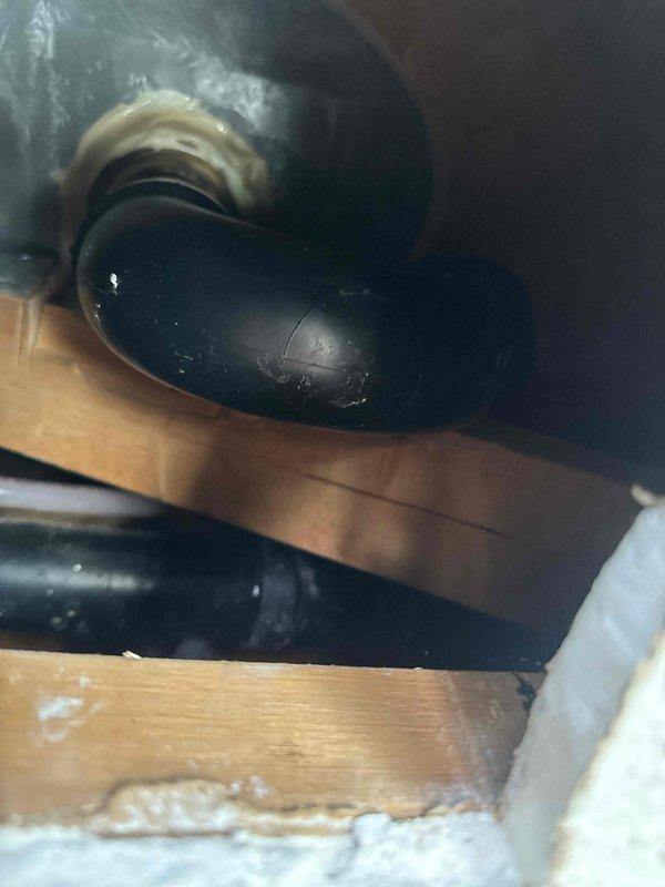 Responded to a service call regarding a leak from upstairs shower causing water spot on ceiling below. Diagnostic investigation revealed leak originating from damaged O-ring seal at drain assembly. Completed repair by replacing deteriorated O-ring and installing shims under drain pipe to ensure proper alignment and seal integrity.