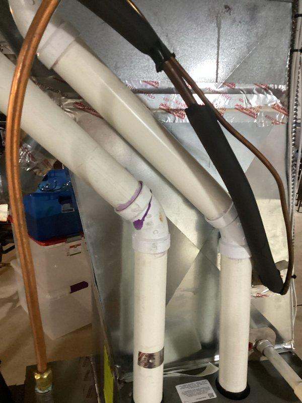 Performed scheduled tune-up service on a Lennox furnace system. Completed comprehensive inspection of the unit, including examination of the PVC exhaust venting, copper refrigerant lines, and associated humidifier/air purifier components. All systems tested and operating within normal parameters; no issues identified requiring further attention.