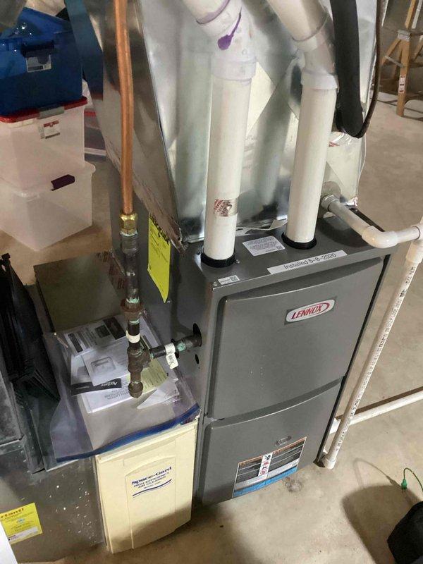 Performed scheduled tune-up service on a Lennox furnace system. Completed comprehensive inspection of the unit, including examination of the PVC exhaust venting, copper refrigerant lines, and associated humidifier/air purifier components. All systems tested and operating within normal parameters; no issues identified requiring further attention.