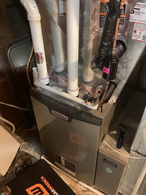 Performed scheduled preventive maintenance tuneup on a Lennox furnace system. Inspected all components including PVC exhaust/intake ventilation, copper lines, and ductwork. All systems functioning properly with no issues identified.