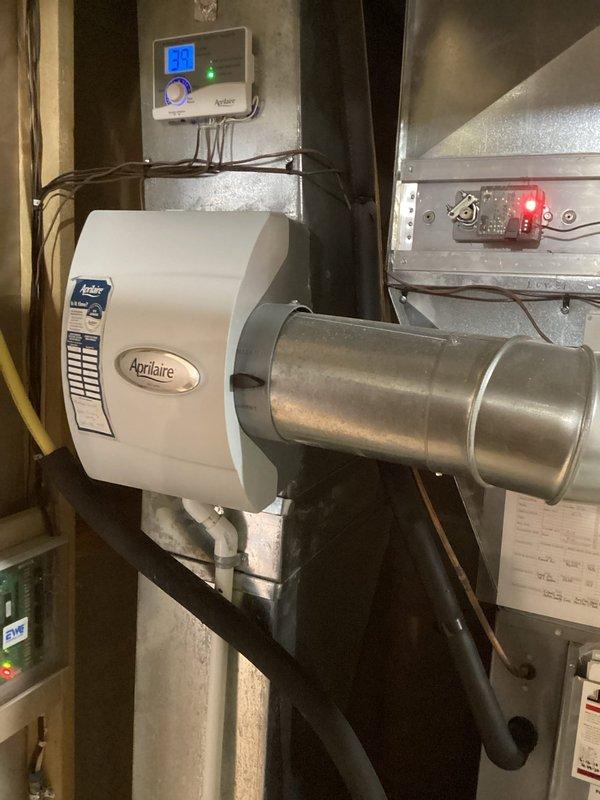 Responded to service call for intermittent humidifier leakage affecting leak detector. Performed inspection of Aprilaire humidifier system and associated components, including evaporator pad, water distribution assembly, and control connections. Conducted system maintenance but leak source was not evident during visit, likely due to its intermittent nature.