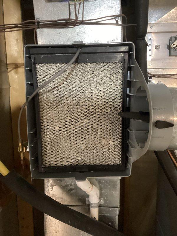 Responded to service call for intermittent humidifier leakage affecting leak detector. Performed inspection of Aprilaire humidifier system and associated components, including evaporator pad, water distribution assembly, and control connections. Conducted system maintenance but leak source was not evident during visit, likely due to its intermittent nature.