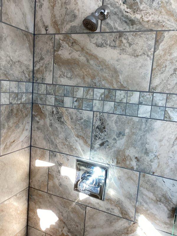 Responded to customer complaint of loud vibration noise in upstairs shower. Performed diagnostics for water hammering in shower valve system but was unable to reproduce the issue during service visit. Recommended installation of hammer arrestors on both hot and cold supply lines to resolve intermittent water hammer problem at the upstairs hallway shower valve.