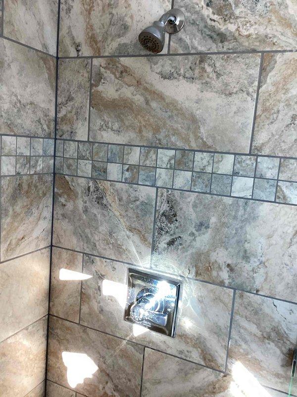 Responded to customer complaint of loud vibration noise in upstairs shower. Performed diagnostics for water hammering in shower valve system but was unable to reproduce the issue during service visit. Recommended installation of hammer arrestors on both hot and cold supply lines to resolve intermittent water hammer problem at the upstairs hallway shower valve.