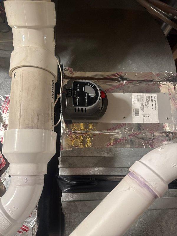 Diagnosed zone control issue where downstairs damper was stuck in closed position. Verified proper voltage and confirmed no blockage in damper assembly. Replaced faulty zone damper actuator to restore proper zoning functionality.