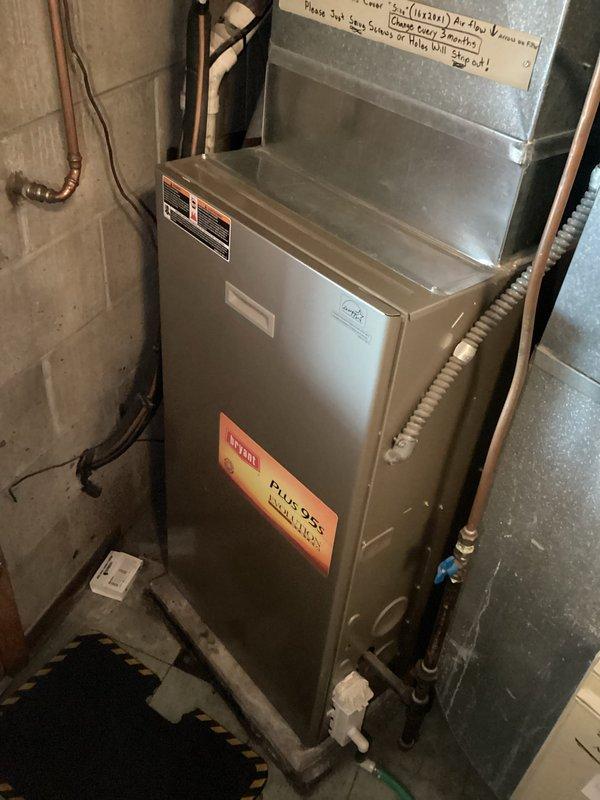 Responded to no-heat call for one of two furnaces in the residence. Upon inspection, diagnosed a plugged condensate drain line which was causing unit to surge. Successfully cleared the blockage, restoring normal operation to the affected furnace.