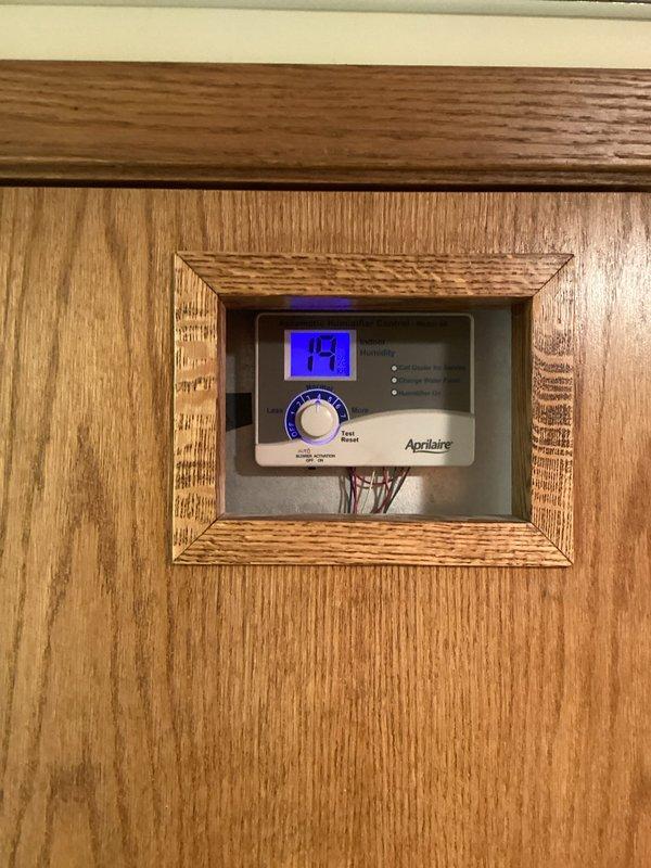 Responded to customer call for leaking Aprilaire humidifier. Conducted thorough inspection of the unit and associated components but was unable to recreate reported leak. System was functioning normally at time of service with no visible issues. Humidity control panel showing 19% relative humidity.