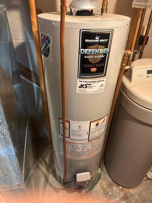 Responded to service call for water pressure issues. Diagnosed clogged cartridge in downstairs lavatory faucet on hot water side. Determined particles originating from deteriorating anode rod in Bradford White water heater. Scheduled follow-up appointment for water heater replacement.