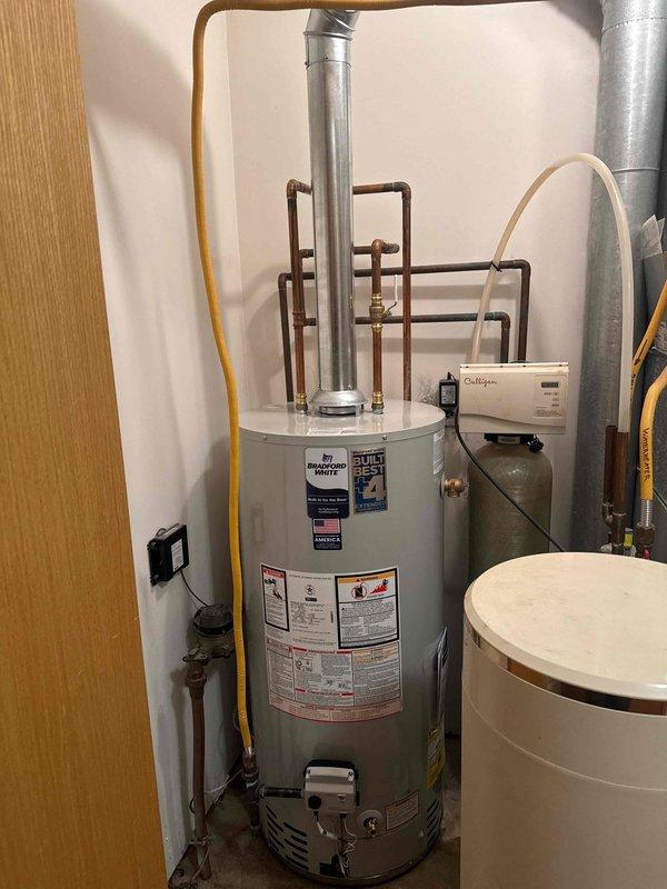 Successfully installed a new 40-gallon Bradford White natural gas atmospheric water heater with all required code upgrades. System was properly connected to existing copper plumbing and gas lines, with functional flue ventilation established. Unit was tested and confirmed to be operating correctly alongside the home's Culligan water treatment system.