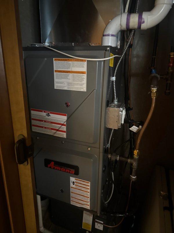 Responded to no heat call for Amana furnace. Diagnosed issue with dirty flame sensor causing system to blow cold air. Performed comprehensive service including cleaning flame sensor, clearing drain line and trap, checking fan speeds, blower capacitor, gas pressure, and electrical components. Completed combustion analysis and replaced air filter to restore proper heating function.
