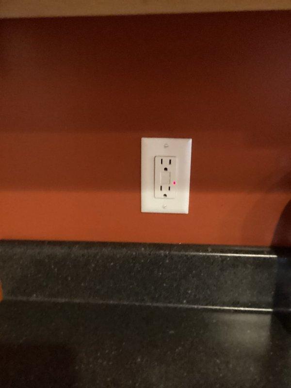 Diagnosed and resolved power issues affecting kitchen outlets and upstairs room. Identified tripped breaker for upstairs outlets and restored power by resetting it. Replaced burnt GFCI receptacle in kitchen that had failed on the load side, restoring functionality to all affected kitchen outlets.