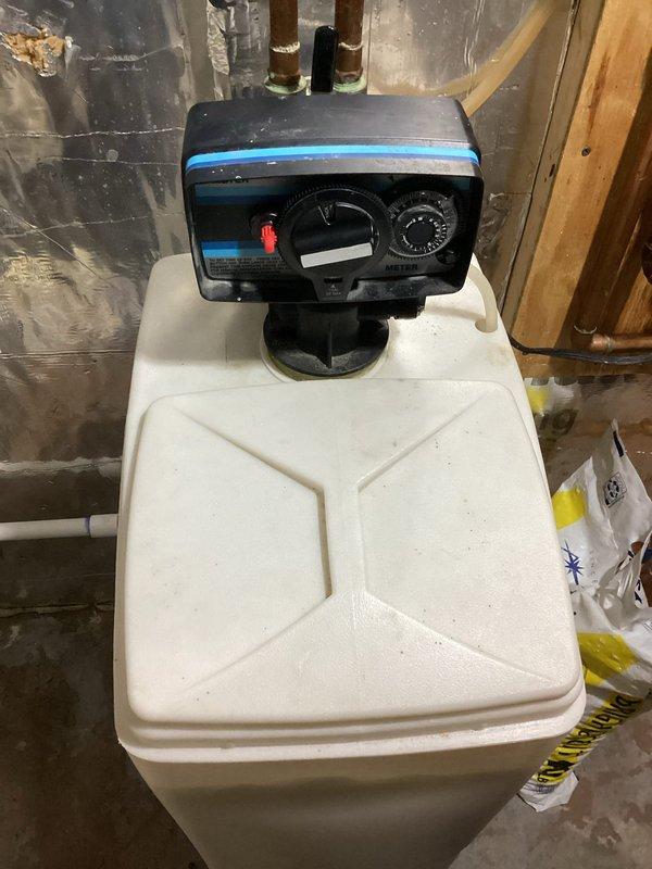 Responded to service call for non-functioning water softener installed in 2010. Performed diagnostic assessment and successfully restored operation through manual regeneration cycle. Informed customer that repair parts are unavailable for this model and provided replacement options via email.