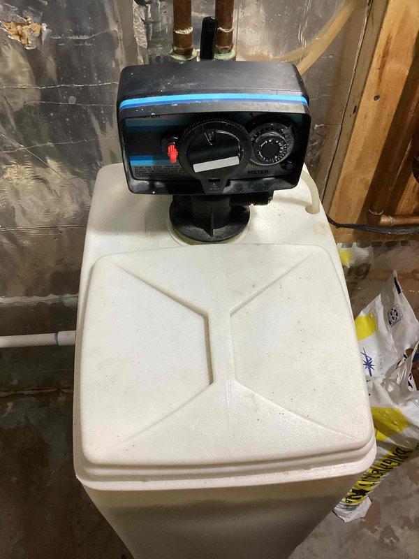 Responded to service call for non-functioning water softener installed in 2010. Performed diagnostic assessment and successfully restored operation through manual regeneration cycle. Informed customer that repair parts are unavailable for this model and provided replacement options via email.