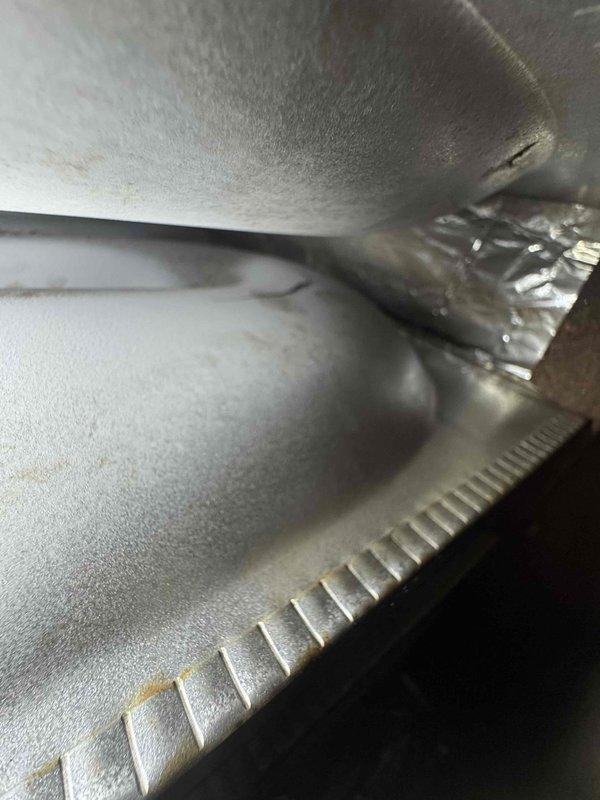 Responded to no-heat emergency at residence with 1993 Carrier furnace. Upon inspection, discovered dead control board and three major cracks in the heat exchanger. Red-tagged the unit, disconnected power and gas supply, and explained carbon monoxide risks to homeowner. Customer has wood stove for temporary heating and declined preventative maintenance visit.