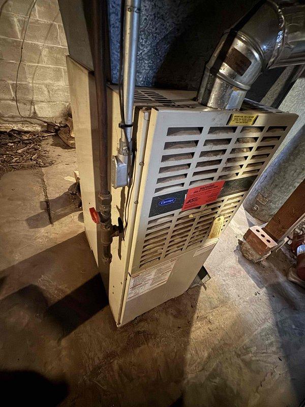 Responded to no-heat emergency at residence with 1993 Carrier furnace. Upon inspection, discovered dead control board and three major cracks in the heat exchanger. Red-tagged the unit, disconnected power and gas supply, and explained carbon monoxide risks to homeowner. Customer has wood stove for temporary heating and declined preventative maintenance visit.