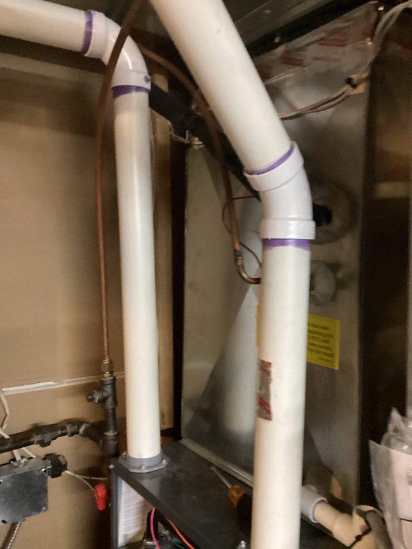 Performed scheduled preventive maintenance agreement service on air handler system. Completed comprehensive tune-up with no issues identified. Documented equipment information via photo documentation, including model AWEC9060309BW (S/N: S847251) and verified proper condensate drain line installation with appropriate PVC piping and connections.