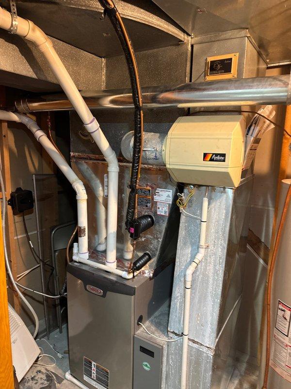 Replaced 40-gallon Bradford White atmospheric natural gas water heater and repaired humidifier system by installing new solenoid valve as per sold proposal. Additionally, replaced leaking copper supply line connected to the Aprilaire humidifier unit mounted adjacent to the furnace system.