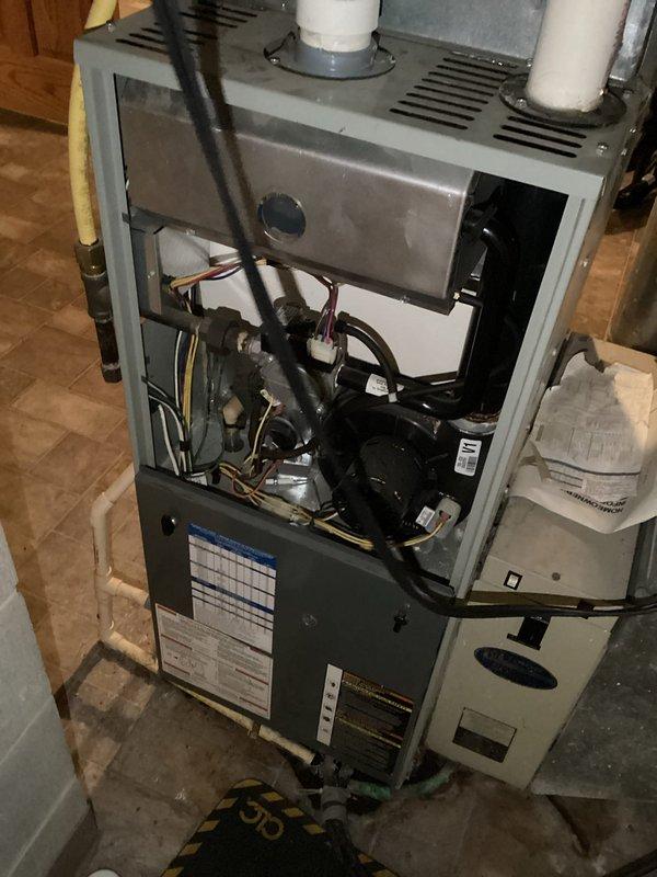 Performed scheduled one-time furnace tune-up service on residential HVAC system. Conducted comprehensive inspection of the furnace unit, including examination of internal components (motor assembly, wiring connections, and ventilation system). Verified proper installation and function of PVC exhaust pipes and drainage connections. System was returned to normal operating condition after maintenance.
