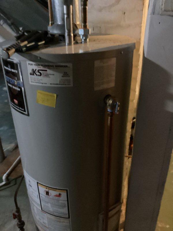 Replaced defective T&P (temperature and pressure relief) valve on JKS water heater that was actively leaking. Removed old valve and installed new replacement valve under existing warranty coverage. System now functioning properly with no leaks observed.