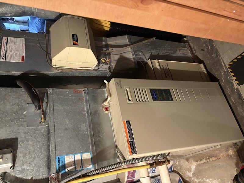 Diagnosed no heat complaint and determined blower motor had failed. Visual inspection of furnace system in basement revealed motor failure beyond repair. Presented customer with options to either replace the motor or install a new furnace unit.