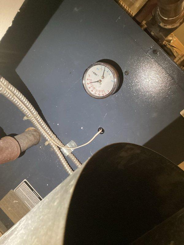 Responded to no heat complaint from boiler system. Inspection revealed low water level causing heating failure. Observed corrosion on pipes and pressure gauge readings below normal operating parameters. Added water to restore proper system pressure and verified heat function before completing service.