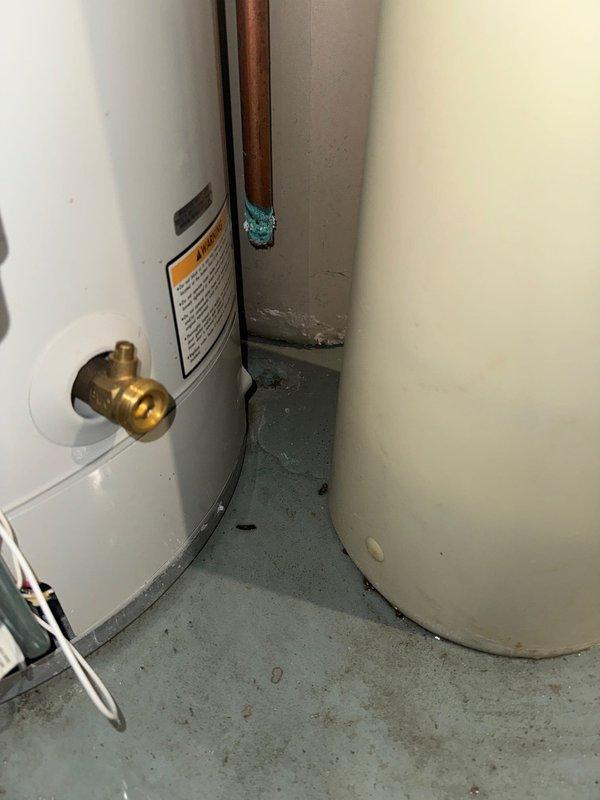 Responded to service call for reported water leak near recently installed furnace. Upon inspection, determined water was not coming from water heater but identified two separate leak sources: drain line and customer's Culligan water softener brine tank. Advised customer to contact Culligan for repairs to their equipment.