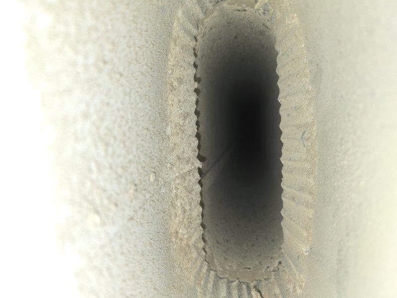 Performed comprehensive duct cleaning service to address accumulated dust and debris in the HVAC system. Visual inspection revealed significant particulate buildup in both rectangular and circular ductwork. Successfully cleaned and removed contaminants from the ventilation system, improving air quality and system efficiency.