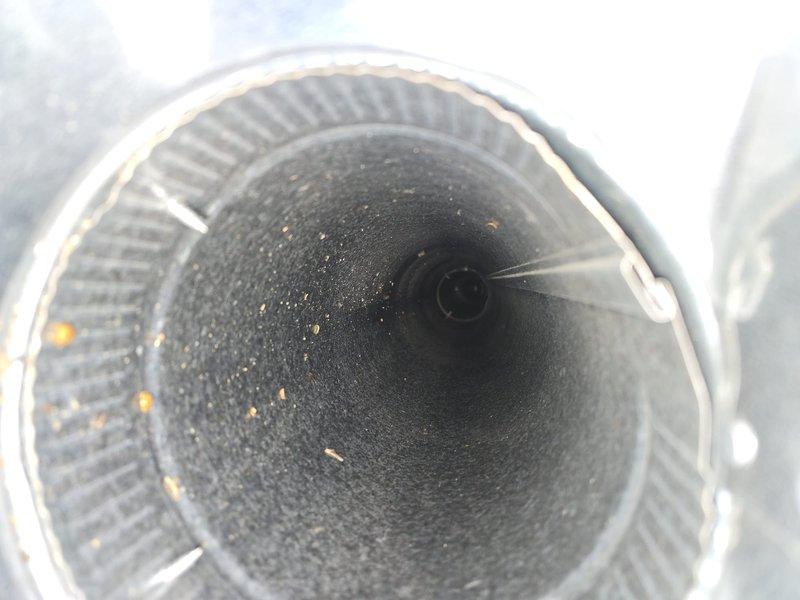 Performed comprehensive duct cleaning service to address accumulated dust and debris in the HVAC system. Visual inspection revealed significant particulate buildup in both rectangular and circular ductwork. Successfully cleaned and removed contaminants from the ventilation system, improving air quality and system efficiency.