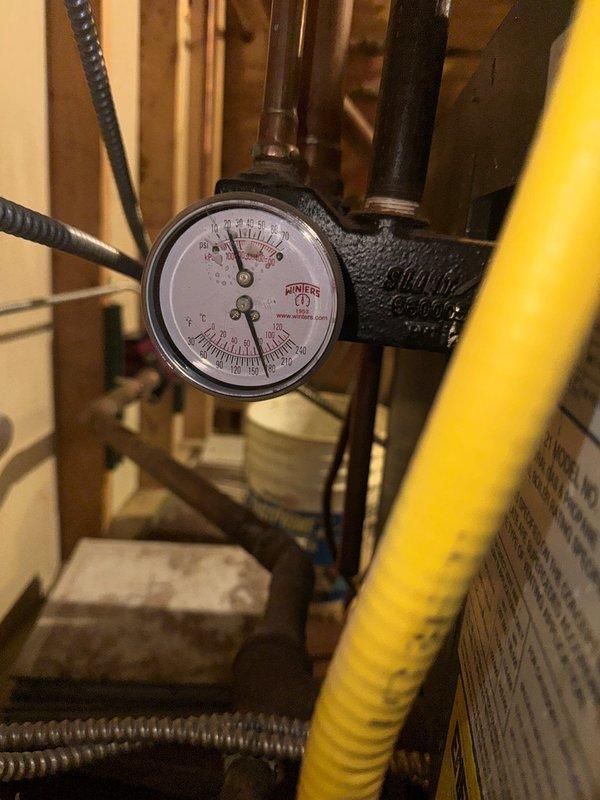 Responded to no heat call for aging boiler system found at 0psi. Restored pressure to 20psi to restore heating function. Identified severely corroded mixing valves with active leaks causing pressure loss. Recommended replacement of failing mixing valves and installation of an autofill valve to maintain proper system pressure.