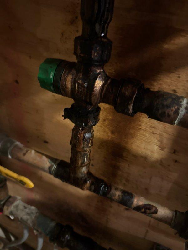 Responded to no heat call for aging boiler system found at 0psi. Restored pressure to 20psi to restore heating function. Identified severely corroded mixing valves with active leaks causing pressure loss. Recommended replacement of failing mixing valves and installation of an autofill valve to maintain proper system pressure.